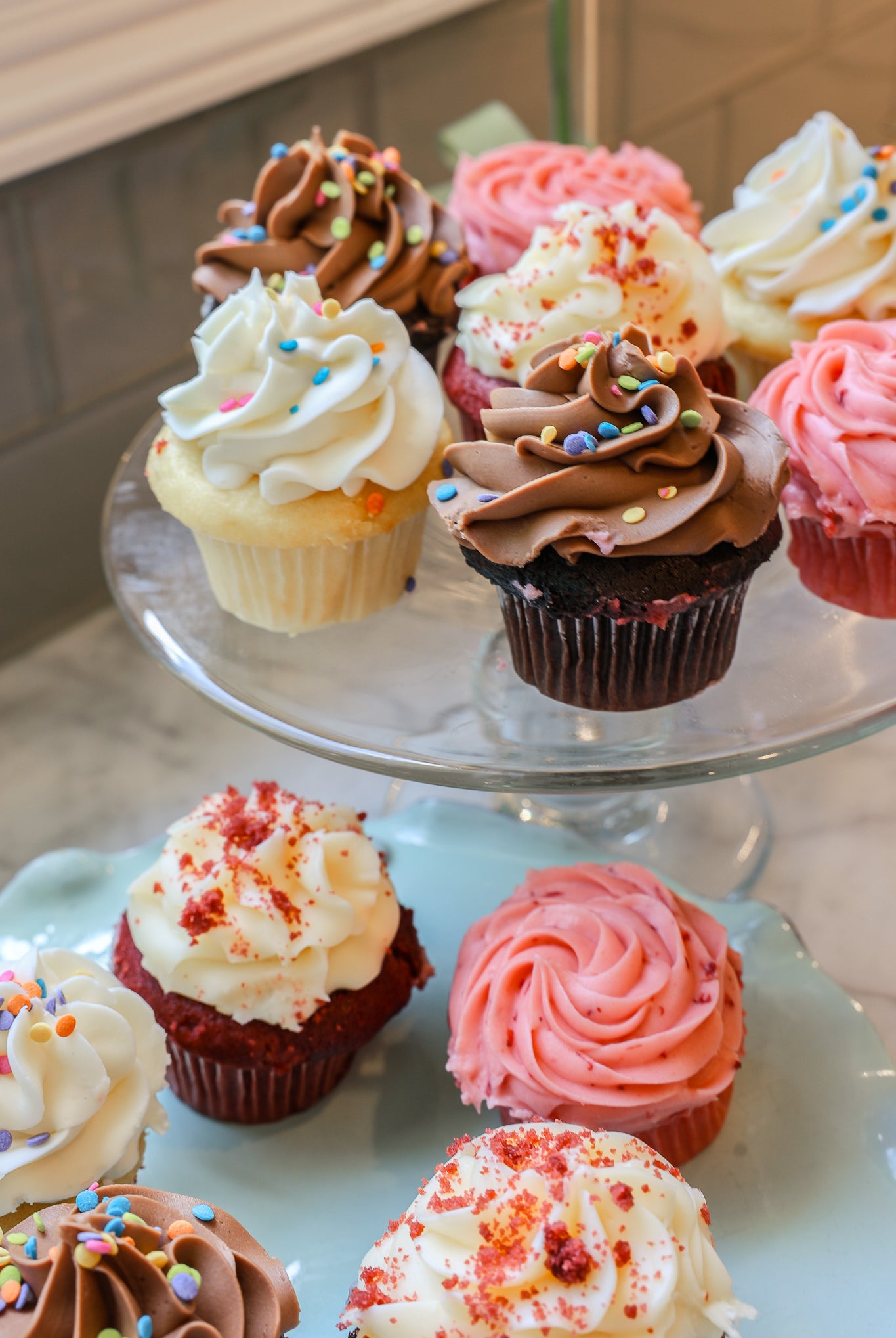 Chocolate, strawberry, vanilla and red velvet cupcakes on a platter