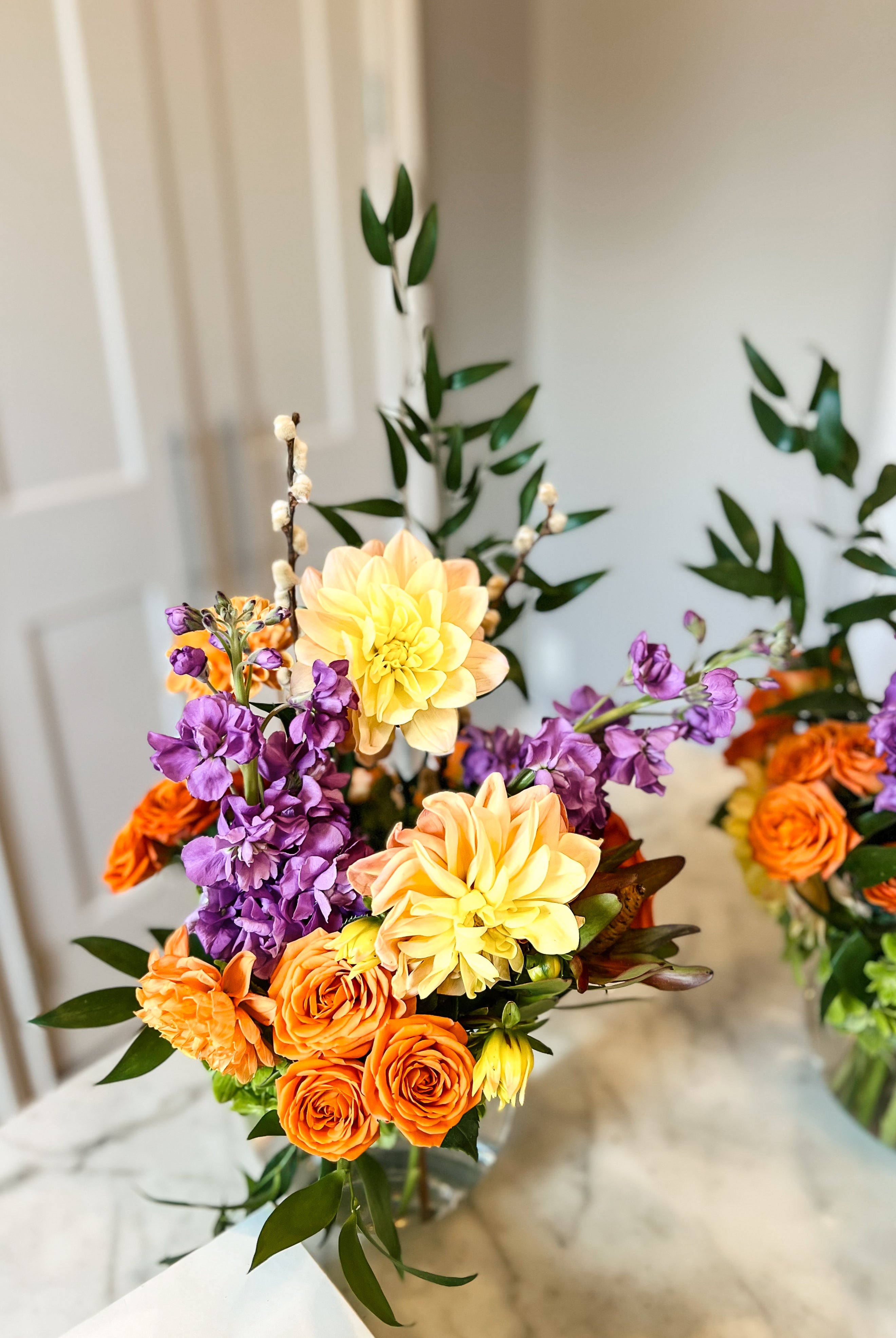 Orange, yellow and purple flower arrangement