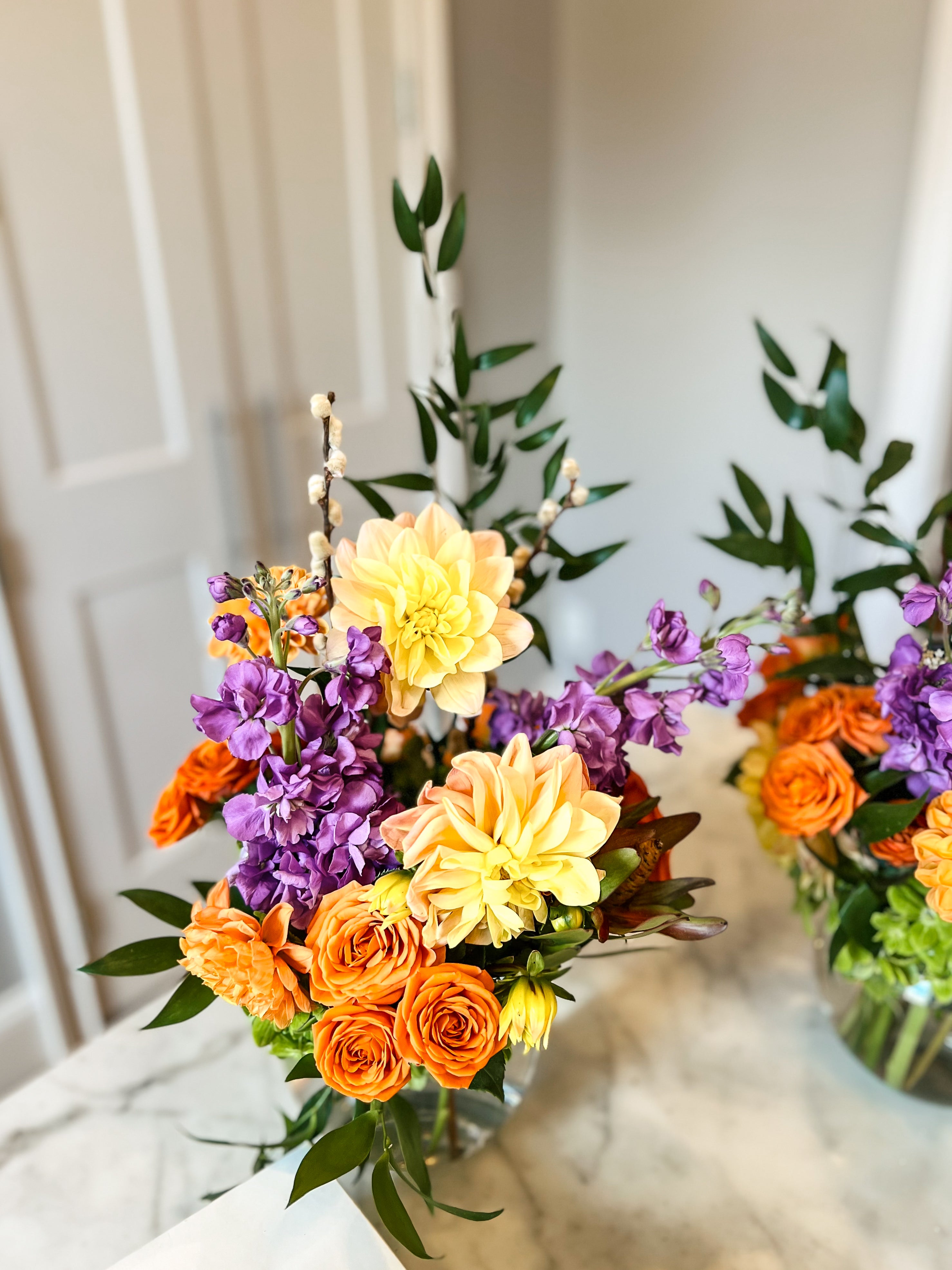Orange, yellow and purple flower arrangement