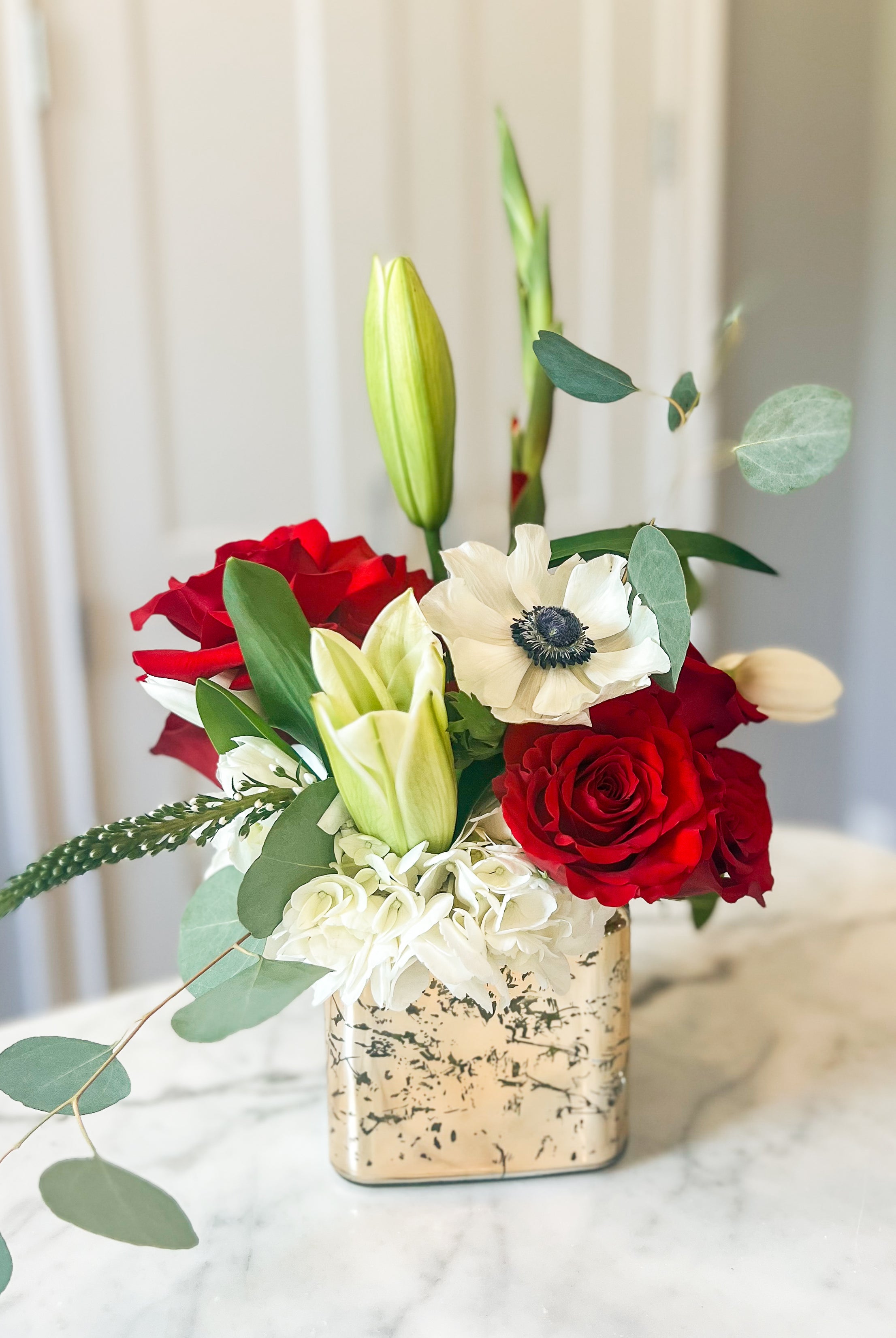 Alabama themed flower arrangement with red and white flowers