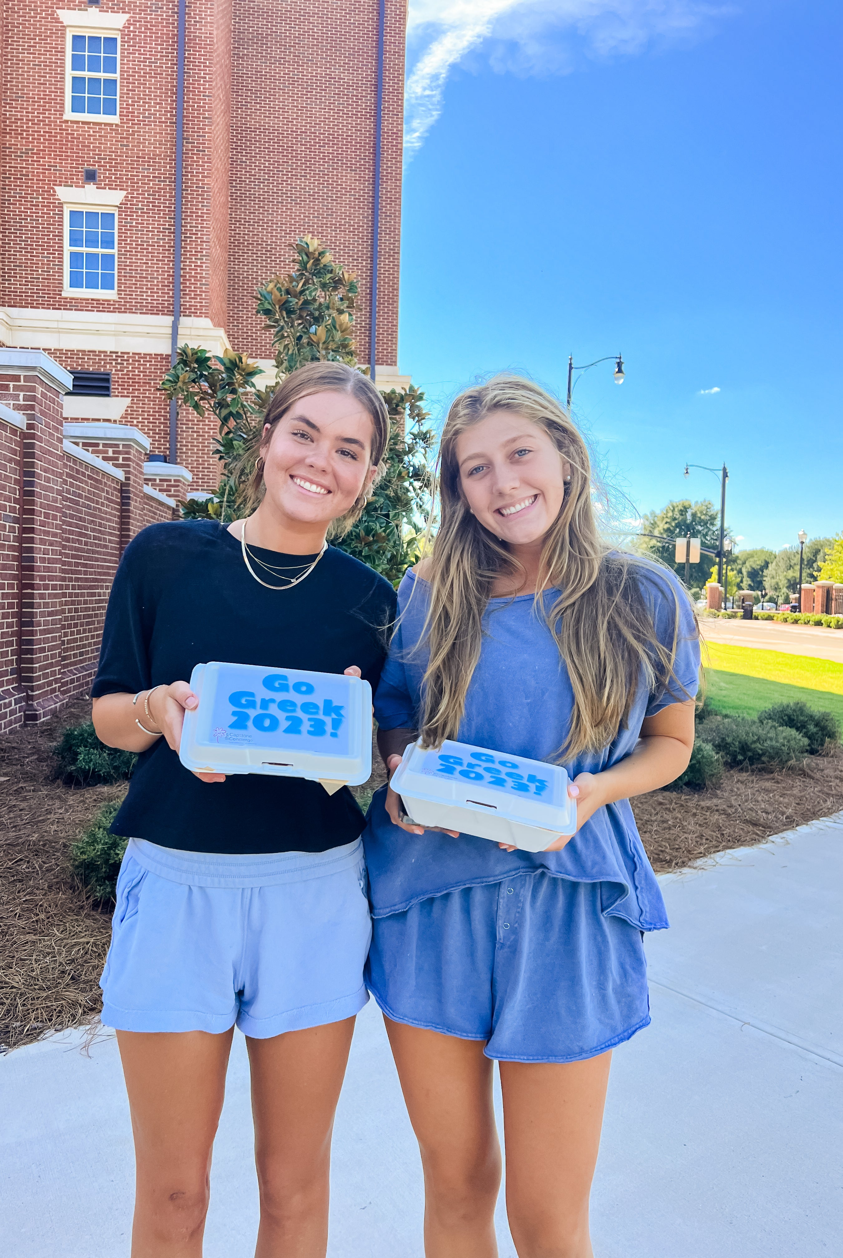 Two girls received go greek boxes delivered to University of Alabama campus