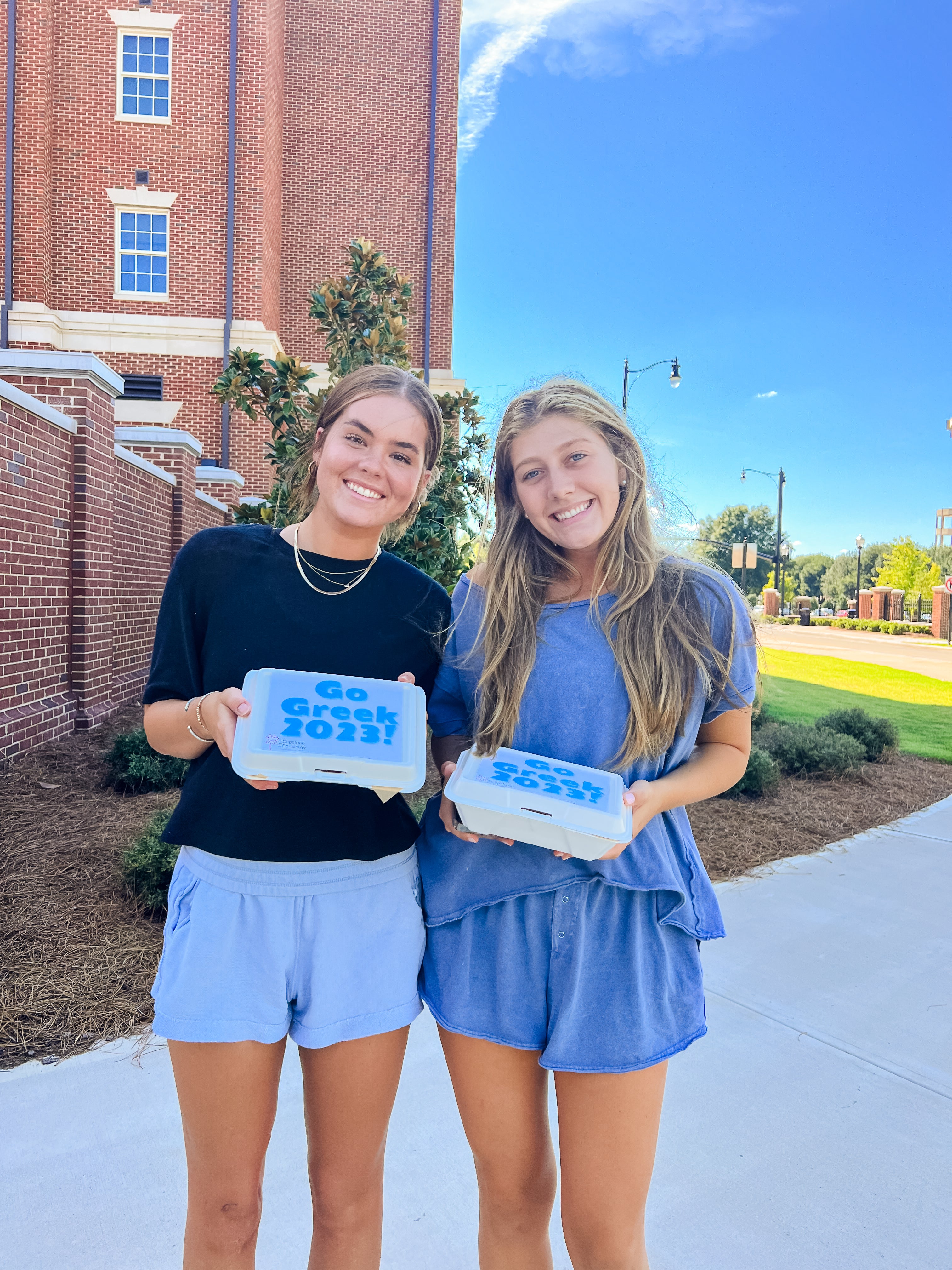 Two girls received go greek boxes delivered to University of Alabama campus